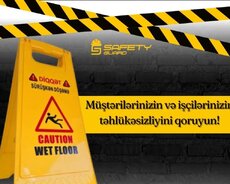 Sahənin (yerin) yaş olmasını xəbərdarlıq nişanı (iki tərəfli)