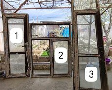 Yeni tikili binadan çıxan qapı pəncərə